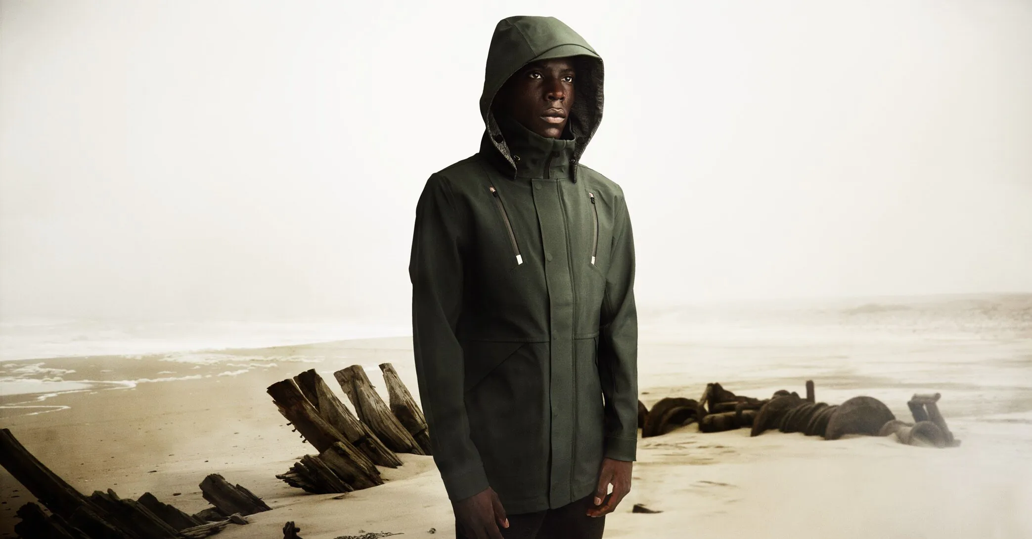 Ulterior green hardshell jacket in changing weather